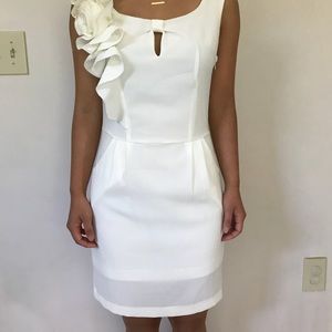 White dress with flower on shoulder
